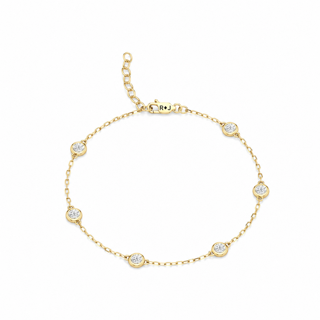The Zoe petite diamond station bracelet in 18K yellow gold with lobster clasp, full top view