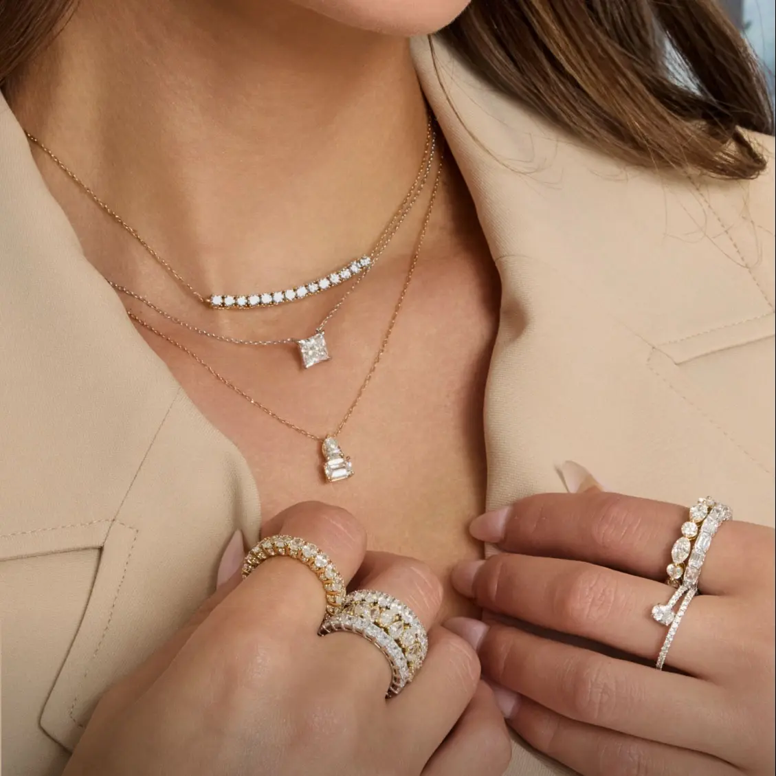 Custom layered diamond necklace stack with princess and emerald cut pendants in solid yellow gold