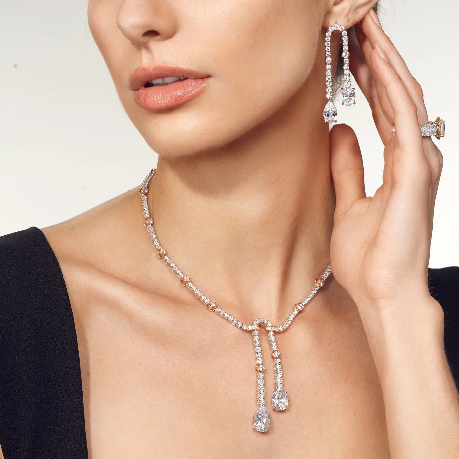Custom diamond drop necklace and pear-cut earring suite in solid 18k gold