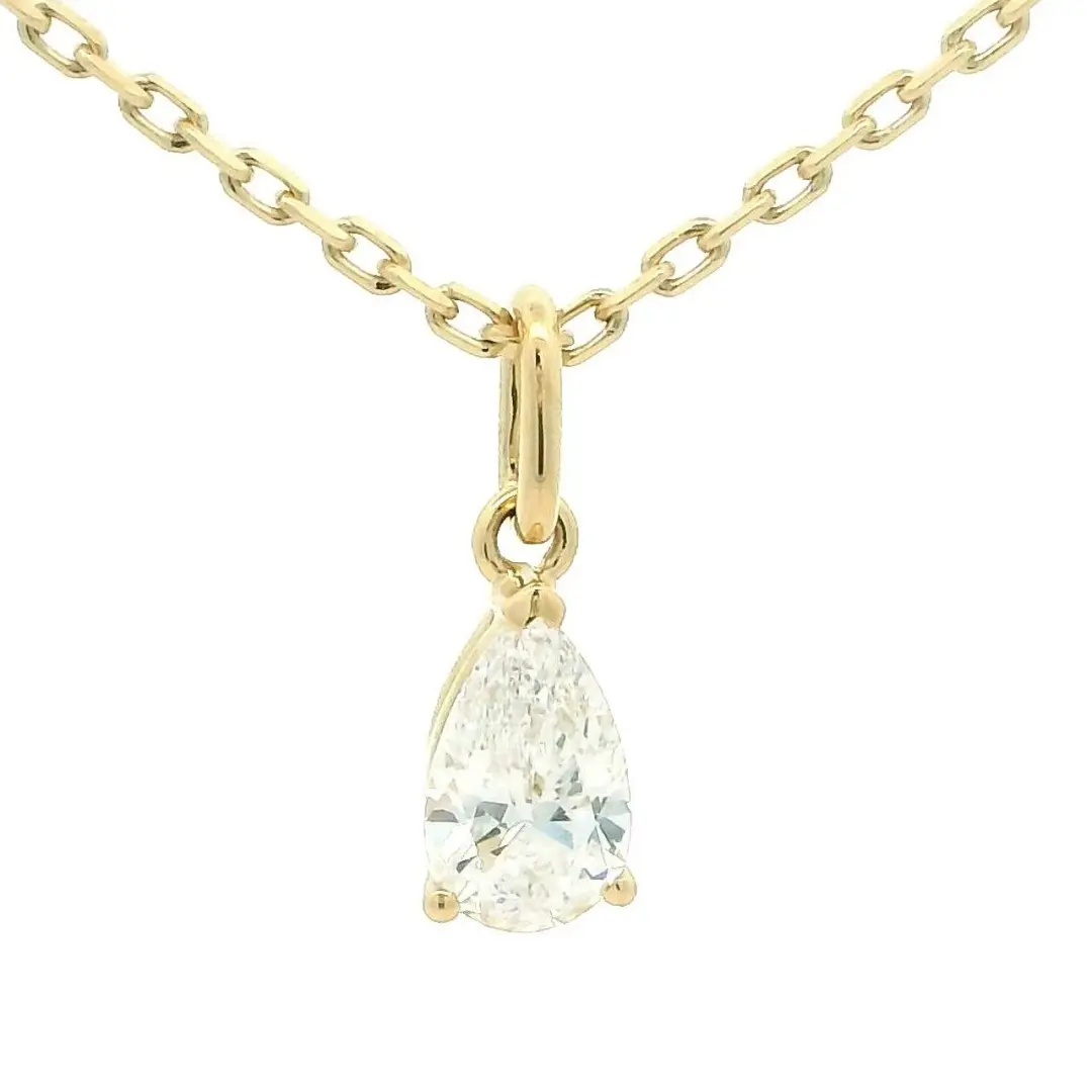 Pear cut lab diamond solitaire pendant in 18K yellow gold on a diamond-cut cable chain