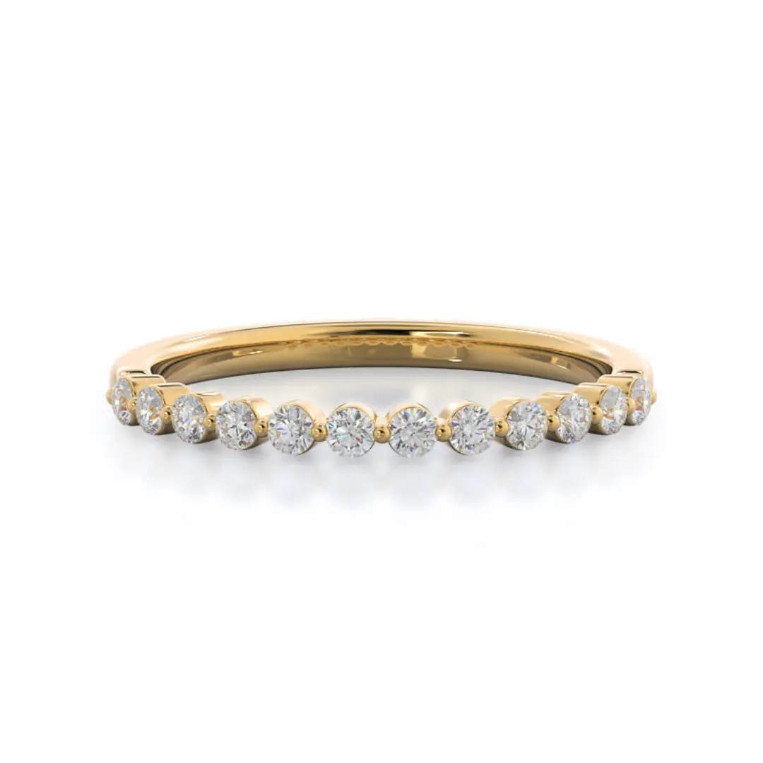 the under bezeled accent diamond wedding band in 18k yellow gold with a row of round lab grown diamonds