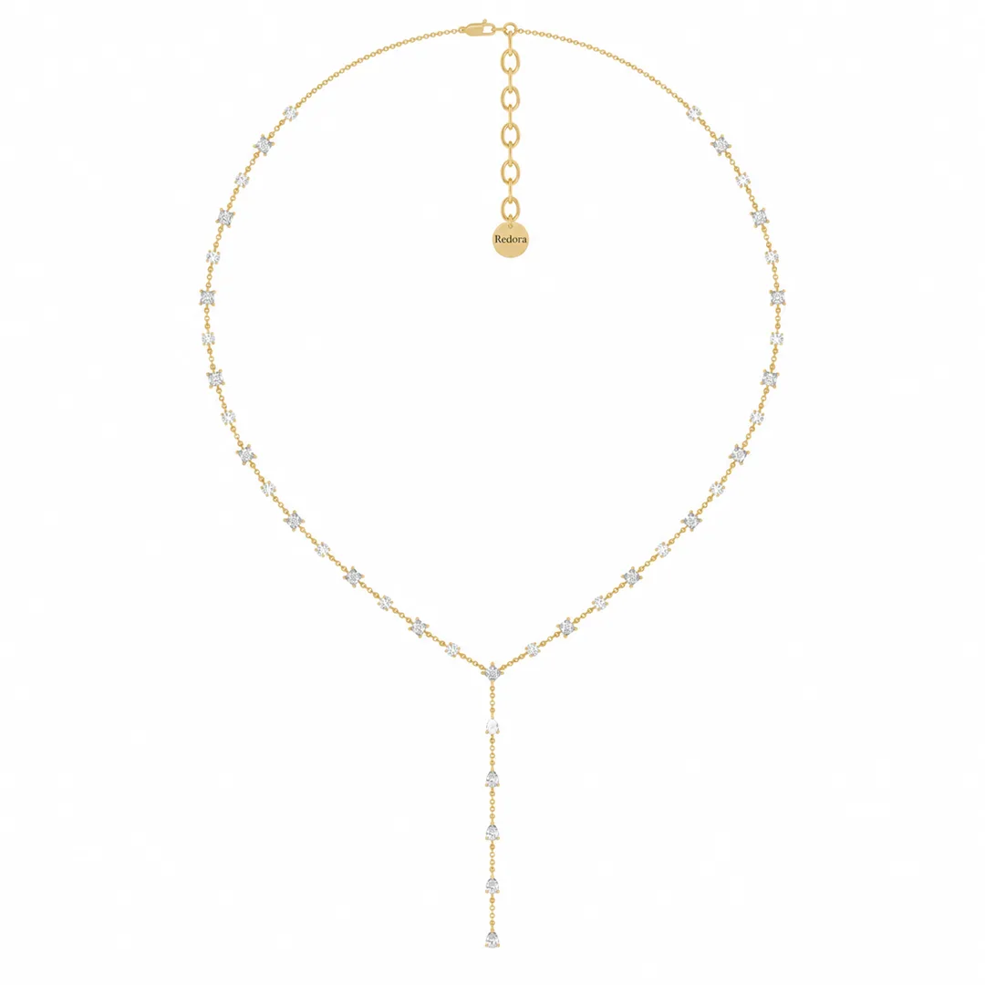 mixed shape diamond lariat necklace in 14k yellow gold laid flat, with the y drop and tagged extension