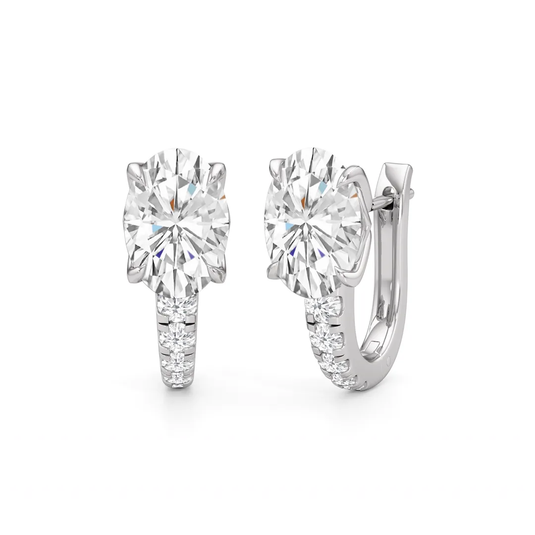 oval diamond huggie earrings in 14k white gold, front and side view