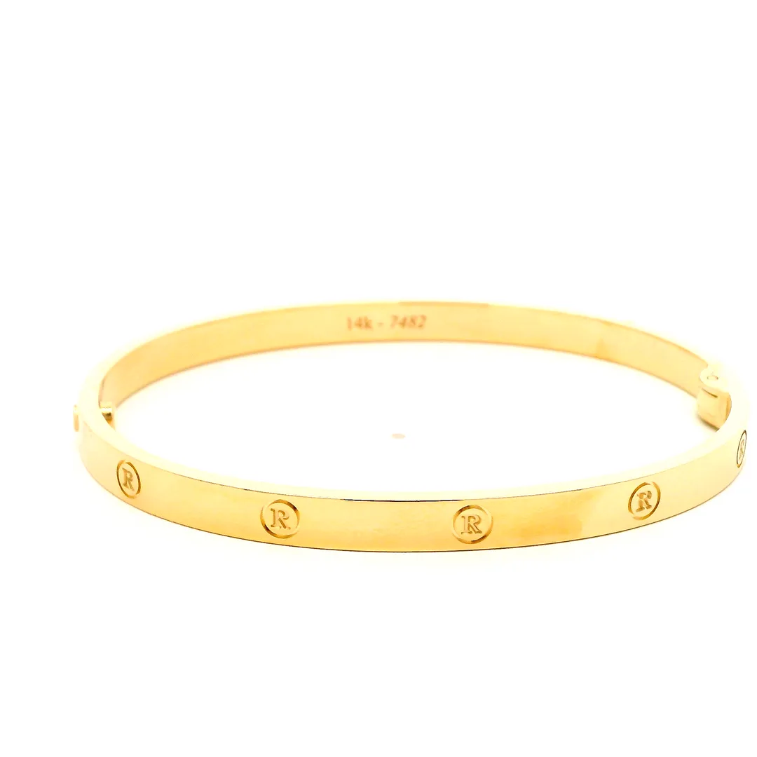 custom gold bangle in 14k yellow gold with letter r roundels, front view